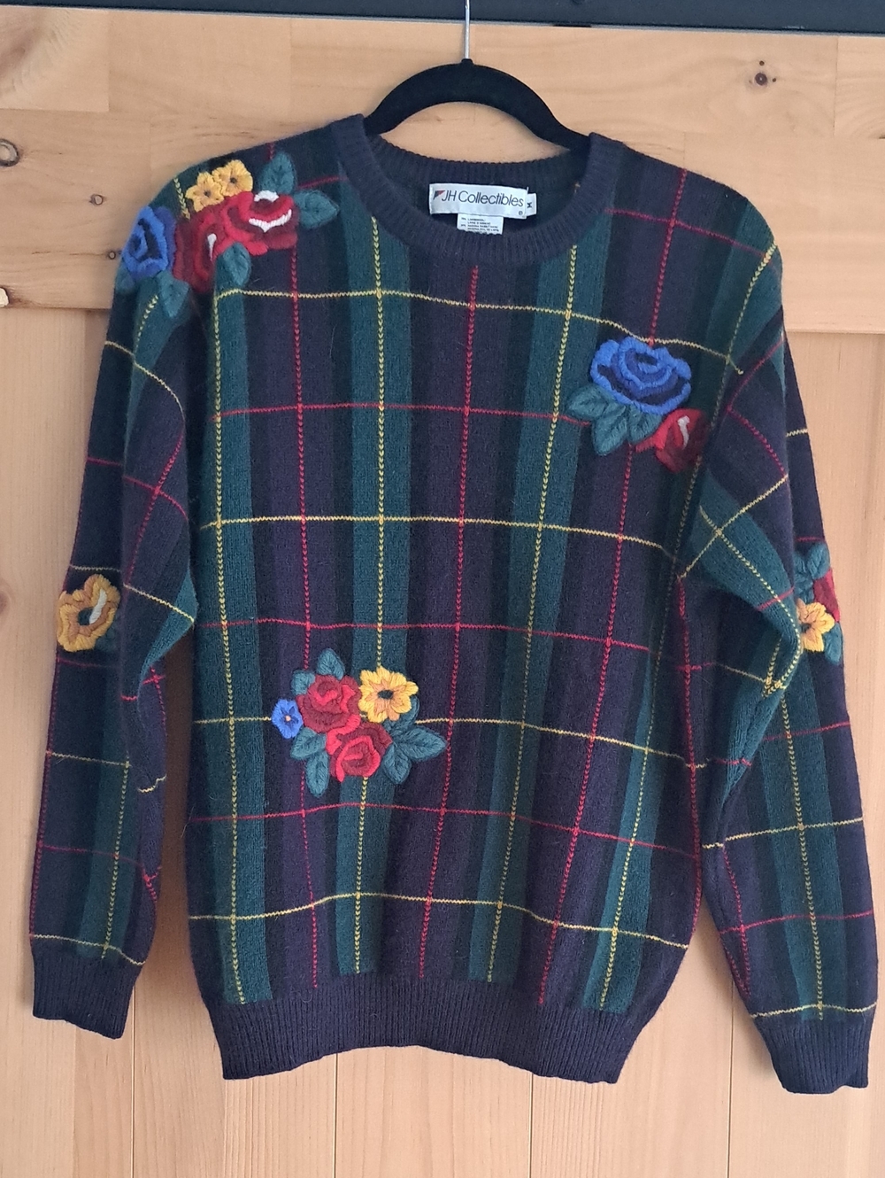 JH Collectibles Green Plaid Crewneck Sweater with Multicolor Floral Embroidery.